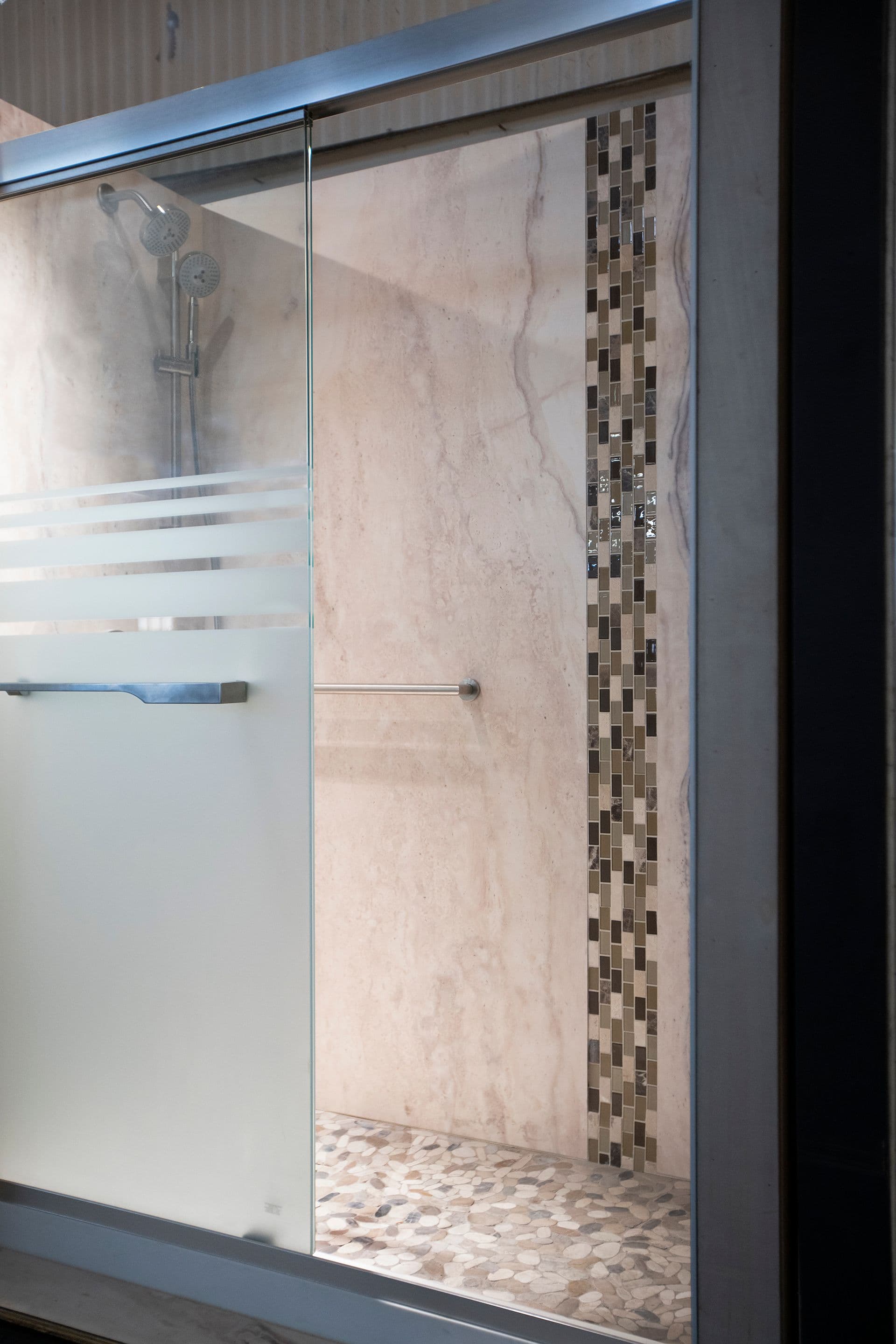 A newly-remodeled bathroom with a walk-in shower.